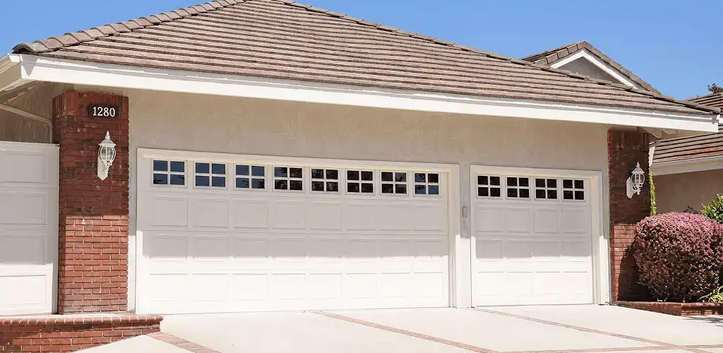 Residential garage door repair service for a double garage door in Atlanta, GA