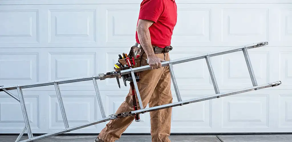 Garage door repair technician arriving with tools and ladder in Atlanta, GA