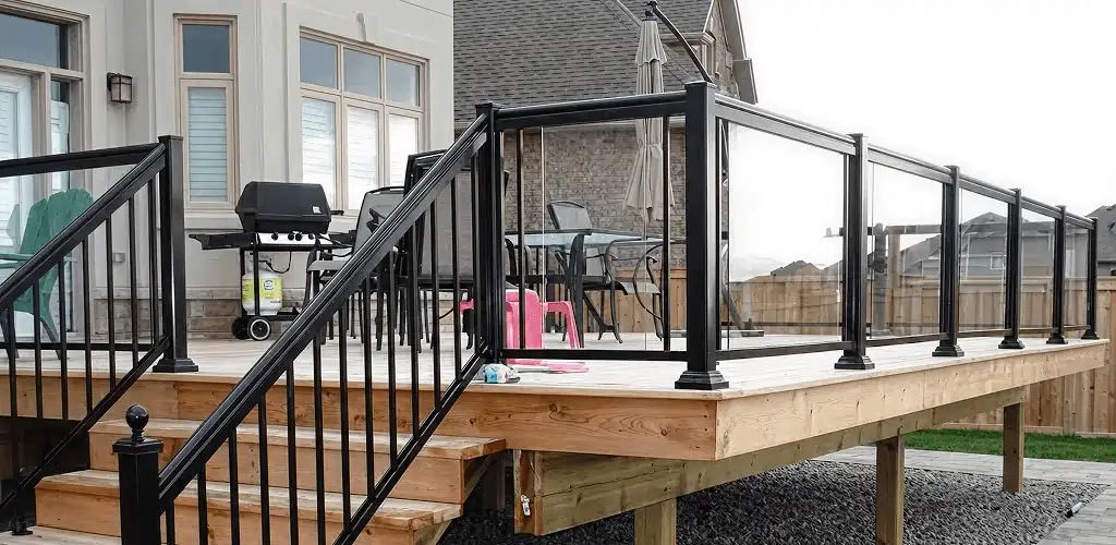 Handrail installation on a deck staircase for safety and code compliance in Atlanta, GA