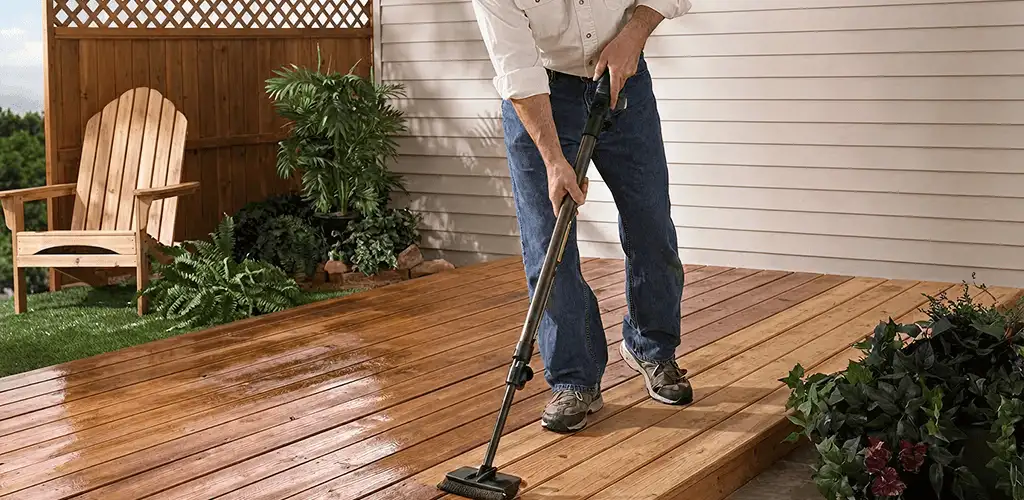Deck staining service applying stain to a backyard wood deck in Atlanta, GA